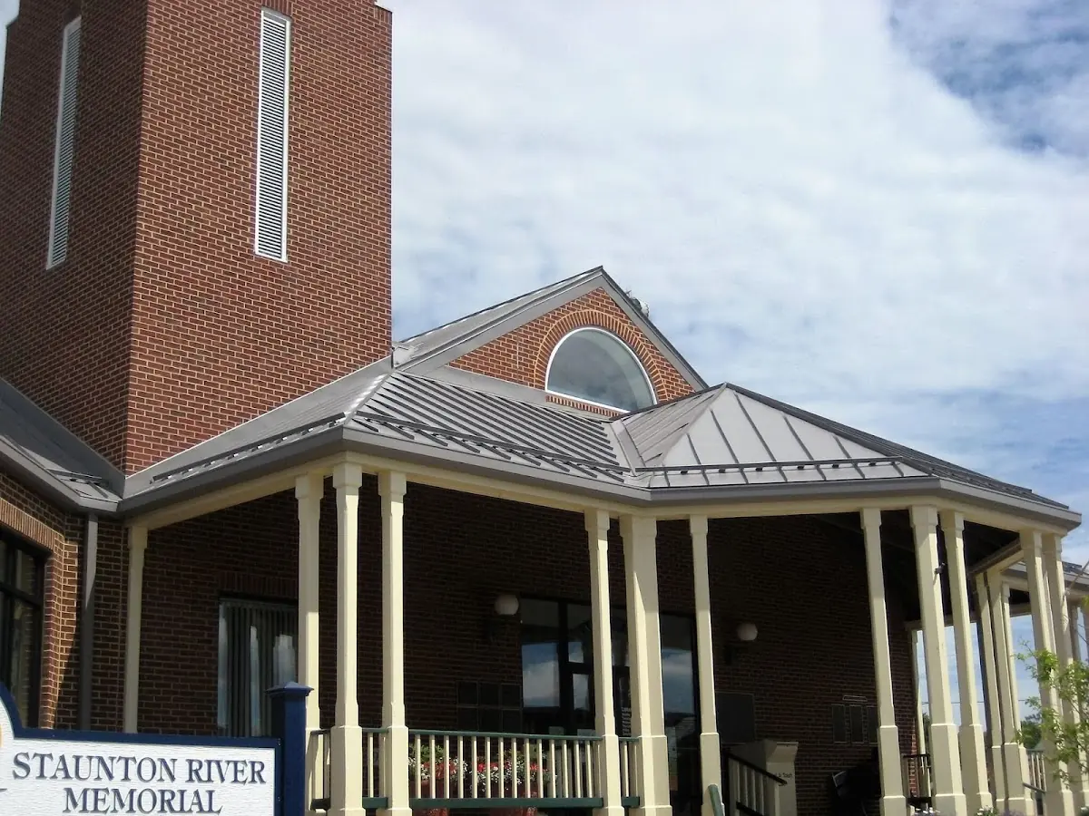 Skilled roofing craftsmen working on a residential roof in Barrett Green